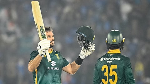South Africa's Aiden Markram (L) celebrates after scoring a century (100 runs) during the second one-day international (ODI) cricket match between India and South Africa at the Shaheed Veer Narayan Singh International Cricket Stadium in Raipur on December 3, 2025. 