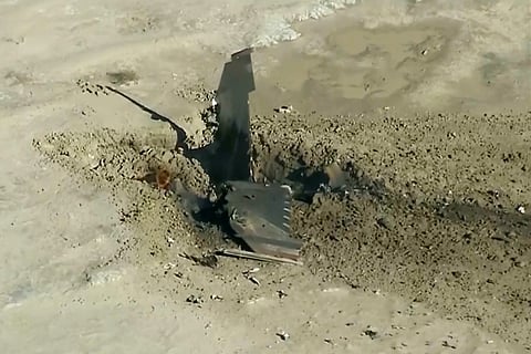 This image taken from video provided by ABC7 Los Angeles shows an Air Force fighter jet after it crashed during a training mission Wednesday, Dec. 3, 2025, in San Bernardino County, Calif.