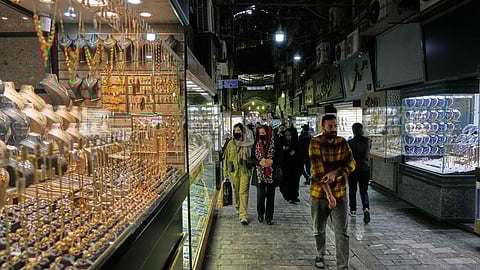 People walk at a gold market in Tehran's Grand Bazaar, Iran, Saturday, Nov. 29, 2025.