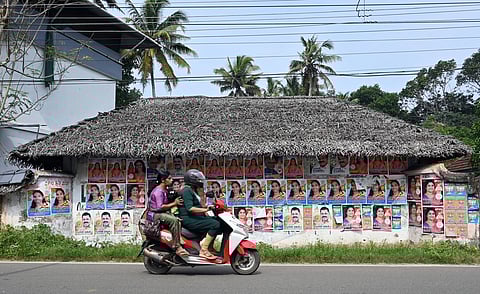 A house wall in Azhoor Gram Panchayat, Thiruvananthapuram, displays election posters of candidates.