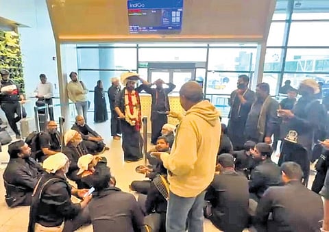 Ayyappa devotees chants devotional songs as IndiGo flight delay keeps them waiting at Hyderabad airport.