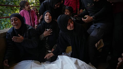 Mourners attend the funeral of Palestinians killed in an Israeli military strike, at Nasser Hospital in Khan Younis, Gaza Strip, Thursday, Dec 4, 2025.