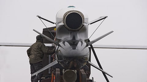 Workers and military inspect Ukrainian Fire Point's Flamingo missiles during handover to the military in an undisclosed location in Ukraine Thursday, Dec. 4, 2025. 