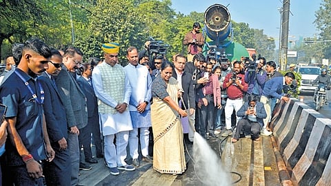 Delhi Chief Minister Rekha Gupta cleans a portion of Ring Road on Saturday.