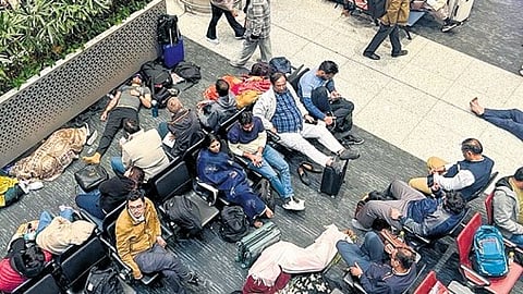 Stranded passengers at Indira Gandhi International Airport on Friday.