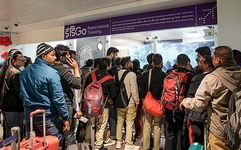Passengers stand in a queue at an IndiGo airline's counter at Terminal 1 (T1) of the Indira Gandhi International Airport, in New Delhi, Saturday, Dec. 6, 2025