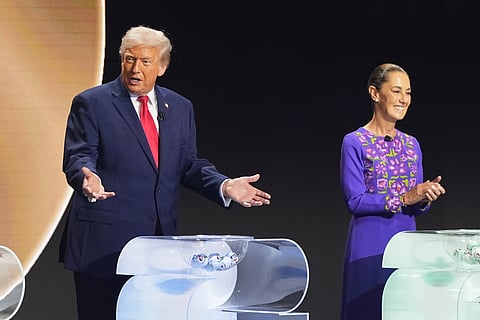 President Donald Trump speaks next to Mexican President Claudia Sheinbaum during the draw for the 2026 soccer World Cup at the Kennedy Center in Washington, Friday, Dec. 5, 2025.