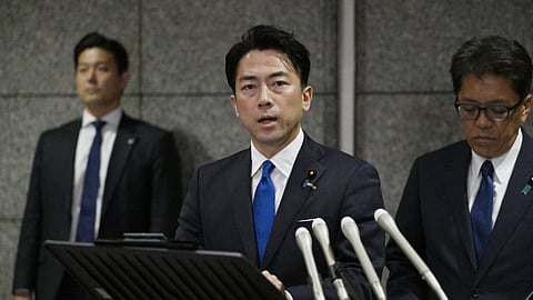Japan's Defense Minister Shinjiro Koizumi, center, speaks to the media, as Japan announced that a Chinese military aircraft locked its radar on Japanese jets, at the ministry in Tokyo, Sunday, Dec. 7, 2025. 