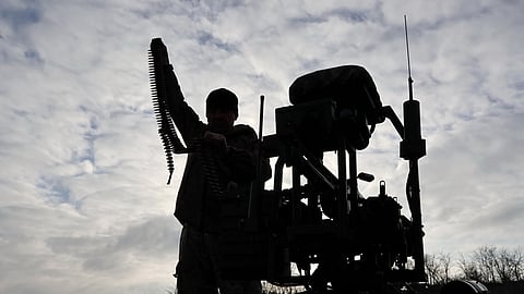 In this photo, provided by Ukraine's 65th Mechanised Brigade press service, a soldier tests land drones in the Zaporizhzhia region, Ukraine, Saturday, Dec. 6, 2025.
