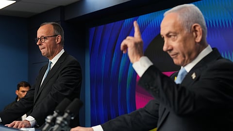 Israeli Prime Minister Benjamin Netanyahu speaks to the media during a joint press conference with German Chancellor Friedrich Merz in Jerusalem Sunday, December. 7, 2025.