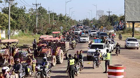 This handout photo taken and released by Agence Kampuchea Press (AKP) on December 8, 2025 shows local residents evacuating following clashes along the Cambodia-Thailand border in Oddar Meanchey province.