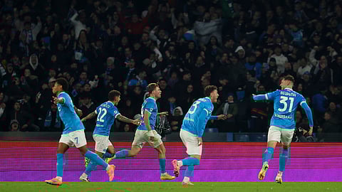 Napoli's Rasmus Hojlund, centre, celebrates after scoring his side's second goal during the Serie A soccer match between Napoli and Juventus, in Naples, Italy, Sunday, Dec. 7, 2025.