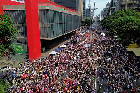 Demonstrators take part in a march against femicide following a series of high-profile cases in the country, in Sao Paulo, Sunday, Dec. 7, 2025. 