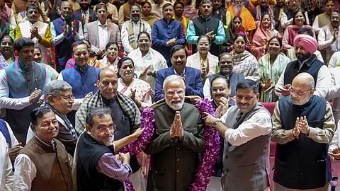  Prime Minister Narendra Modi being felicitated by MPs for the alliance' victory in Bihar Assembly elections during the NDA Parliamentary Party meeting, at Parliament premises in New Delhi, Tuesday, Dec. 9, 2025