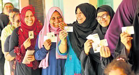 Voters standing in a queue at Little Flower UP School 