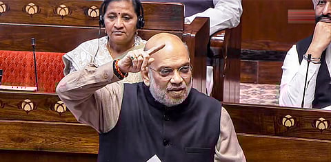 Union Home Minister Amit Shah speaks during a debate on Vande Mataram in the Rajya Sabha at the Winter session of Parliament, in New Delhi, Tuesday, Dec. 9, 2025.