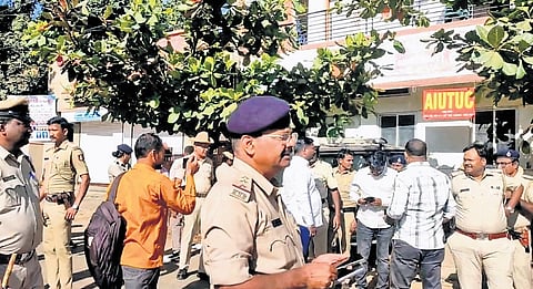 Policemen in front of the SUCI-C office in Dharwad on Wednesday 