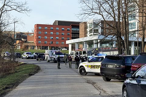 Law enforcement responds to a shooting at Whitney Moore Young Jr. Hall on Kentucky State University's campus in Frankfort, Ky., Tuesday, Dec. 9, 2025.