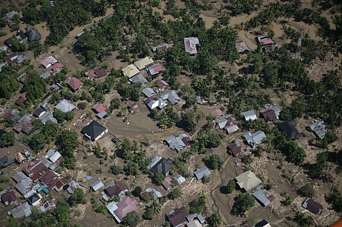 This photo taken from a national disaster mitigation agency’s helicopter during an aerial aid distribution shows an area affected by floods in the aftermath of Cyclone Senyar in Pidie Jaya, Aceh province, Indonesia, Dec. 4, 2025.