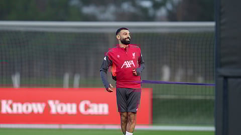 Liverpool's Mohamed Salah smiles as he takes part in a training session in Liverpool, England, Monday, Dec. 8, 2025