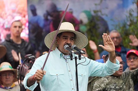 President Nicolas Maduro addresses supporters during a rally marking the anniversary of the Battle of Santa Ines, which took place during Venezuela’s 19th-century Federal War, in Caracas, Venezuela, Wednesday, Dec. 10, 2025. 