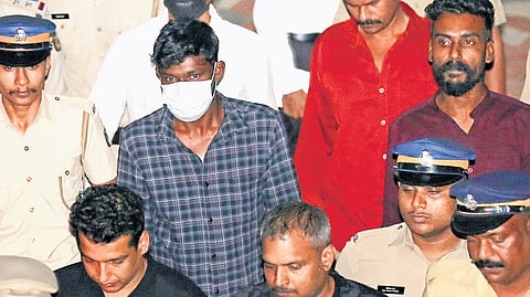 The convicts in the actor abduction and rape case being taken to Viyyur Central jail from the Ernakulam Principal Sessions Court on Friday 