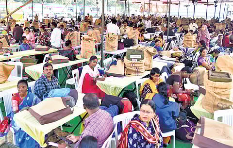 Polling officials busy checking election material for the gram panchayat elections 
in Manakondur of Karimnagar district on Saturday.
