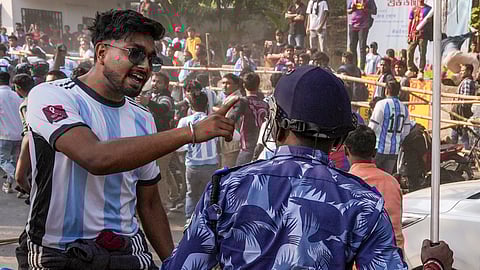 Security personnel lathi-charge to disperse fans after they gathered near the VYBK stadium following chaos at an event of Argentine footballer Lionel Messi as part of his 'G.O.A.T.
