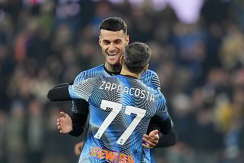 Atalanta's Gianluca Scamacca, left, celebrates after scoring the opening goal during the Serie A soccer match between Atalanta Bergamo and Cagliari Calcio in Bergamo, Italy, Saturday Dec. 13, 2025.