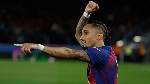 Barcelona's Raphinha celebrates after scoring during a La Liga soccer match between Barcelona and Osasuna in Barcelona, Spain, Saturday, Dec. 13, 2025.