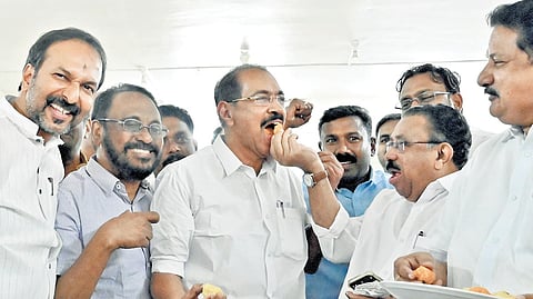 Congress leader M M Hassan offers sweets to state Congress president Sunny Joseph at the KPCC headquarters in Thiruvananthapuram.