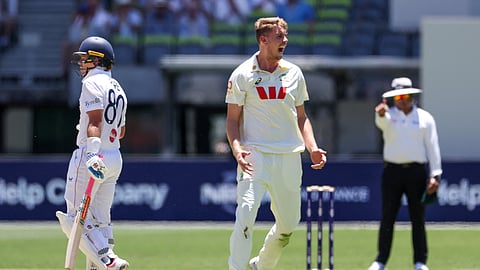 Australia’s Cameron Green (L) celebrates his wicket of England’s Ollie Pope on day 1 of the first Ashes cricket Test match between Australia and England at Perth Stadium in Perth on November 21, 2025. 