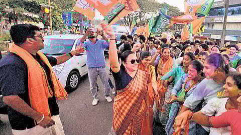 BJP workers along with district president M L Ashwini celebrating the victory of the party in Madhur panchayat in Kasaragod 