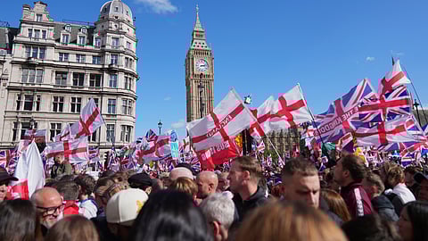 People demonstrate during the Tommy Robinson-led Unite the Kingdom march and rally, in London, Saturday, Sept. 13, 2025. 