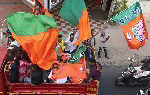 Jubilant party workers during the victory celebration rally of NDA candidates who won the city corporation in the local body elections on Sunday 
