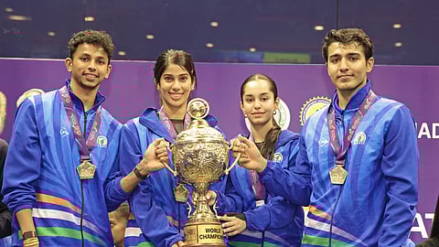 (From L) Velavan Senthilkumar, Joshna Chinappa, Anahat Singh and Abhay Singh pose with the World Cup trophy