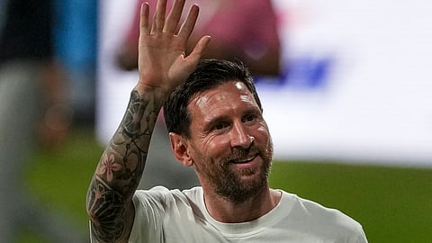  Argentine footballer Lionel Messi greets fans during the 'GOAT India Tour 2025', at Wankhede Stadium, in Mumbai, Sunday, Dec. 14, 2025