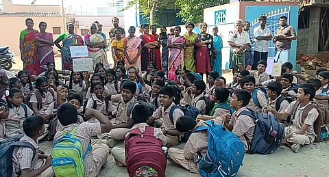 57 students and several parents protested the teacher's transfer.