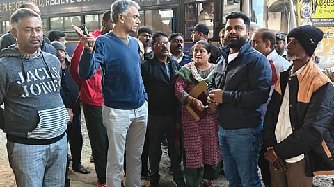 Revenue Minister Krishna Byre Gowda questions officials during his inspection of Metro Phase 2B work on Sunday.