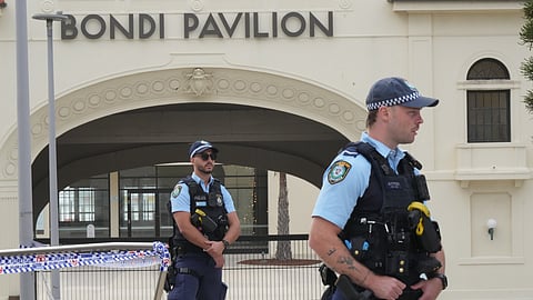 Police patrol in the early morning following a shooting Sunday at Sydney's Bondi Beach, Monday, Dec. 15, 2025.