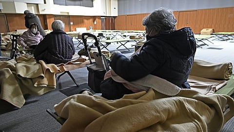 Evacuees get ready to return home as a tsunami advisory has been lifted in Hidaka town, northern Japan, on Tuesday, Dec. 9, 2025, following a powerful earthquake on late Monday.