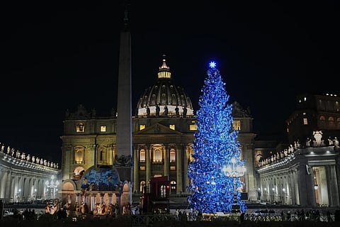 A 27-meter fir tree from the Ultimo valley in South Tyrol, Italy, is lit up as Christmas tree together with a crib in St. Peter’s Square at the Vatican, Monday, Dec. 15, 2025.