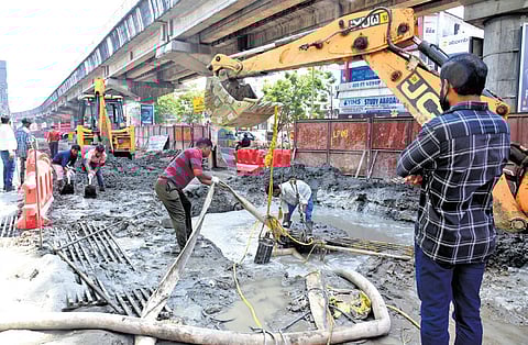 Repair under way in Kaloor where a KWA pipeline burst during the construction of a metro pillar on Monday night.