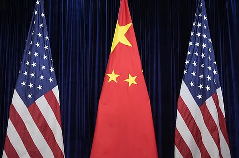 Flags of the U.S. and China are displayed at the Gimhae International Airport in Busan, South Korea, Oct. 30, 2025. 