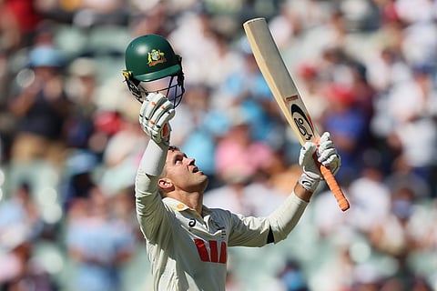 Australia's Alex Carey celebrates his century during play on day one of the third Ashes cricket test between England and Australia at the Adelaide Oval in Adelaide, Australia, Wednesday, Dec. 17, 2025.