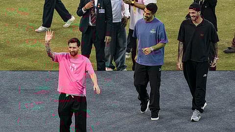 Argentine footballer Lionel Messi greets the gathering during the 'GOAT India Tour 2025', at Arun Jaitley Stadium in New Delhi, Monday, Dec. 15, 2025.