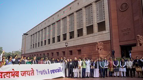 Opposition MPs stage a protest during Parliament's Winter session, in New Delhi, Wednesday, Dec. 17, 2025.