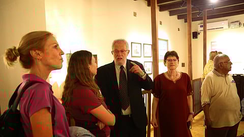 Basil Koder engages with tourists from Israel at the new Jewish museum at Mattanchery.