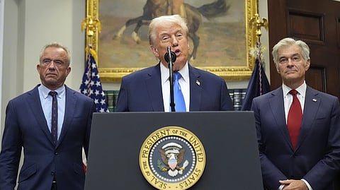 In this photo from Sept. 22, 2025, US President Donald Trump speaks in the Roosevelt Room of the White House, as HHS Secretary Robert F Kennedy Jr (L) and CMS administrator Dr Mehmet Oz (R) listen.