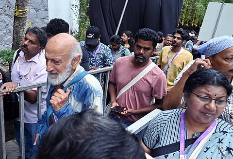 People waiting to watch movies at the 30th IFFK in Thiruvananthapuram, Tagore Theatre on Wednesday.